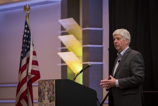 Education conference keynote speaker presenting AI literacy stage